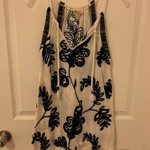 Embroidered knit top. Rope tie/neckline.